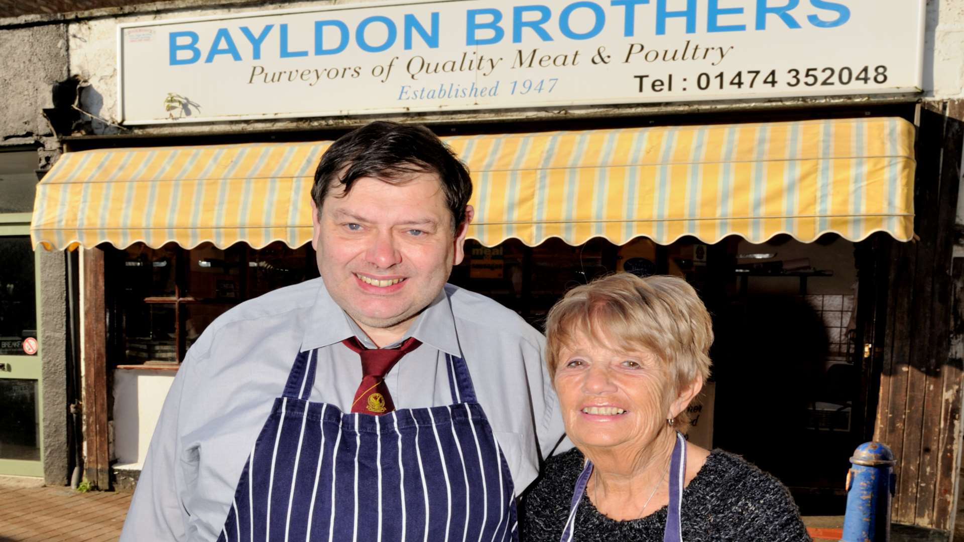 Phillip and Barbara Bayldon outside the shop their family has owned since 1947