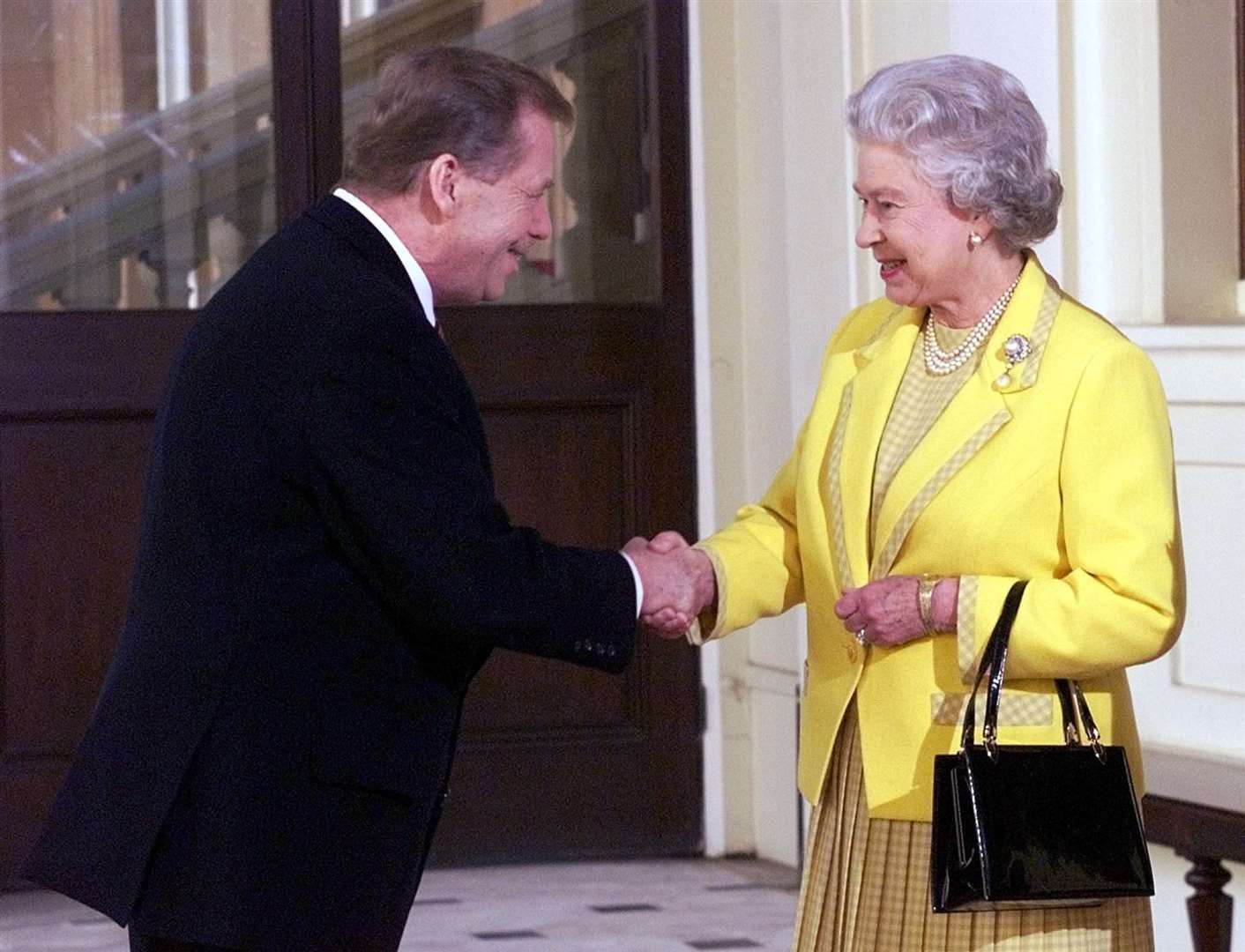 The then president of the Czech Republic, Vaclav Havel is greeted by Britain’s Queen Elizabeth II at Buckingham Palace in 1998 (Dave Caulkin/PA)