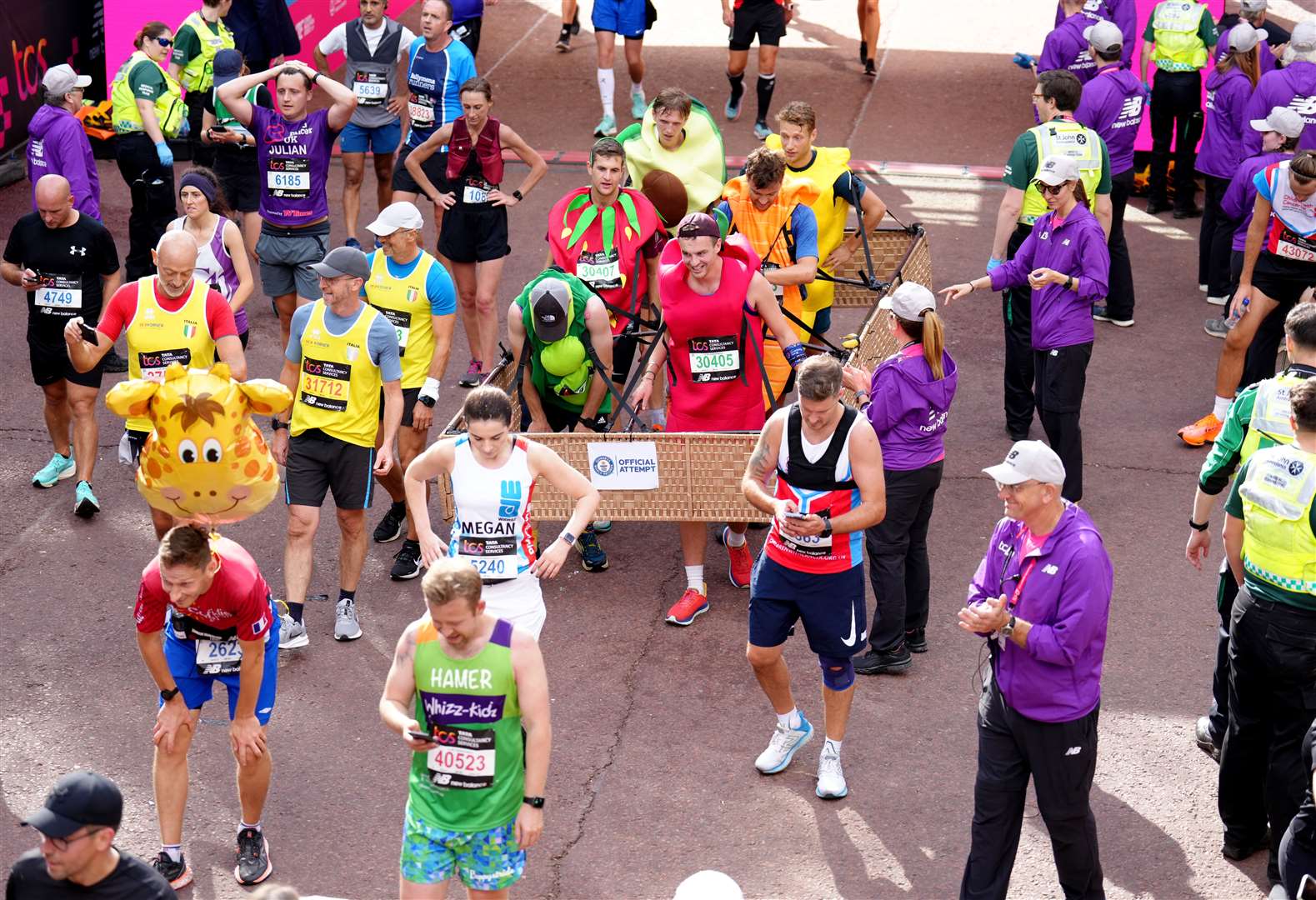 Tristan Clark, Freddie Flanagan, Freddie Wright, John Lavelle, George Peirson and Hugh Williams broke the record for the fastest marathon in a six-person costume (Kirsty O’Connor/PA)