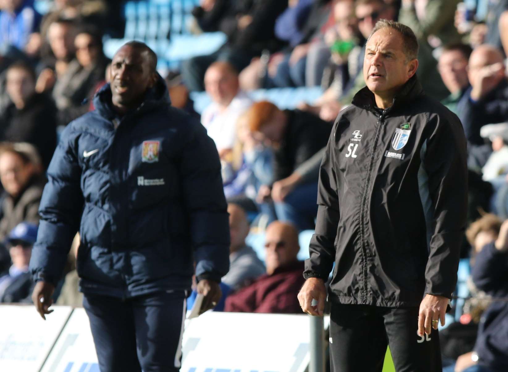 The two managers watch on from the sidelines. Picture: Andy Jones