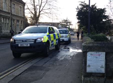 The cars were parked opposite the police station