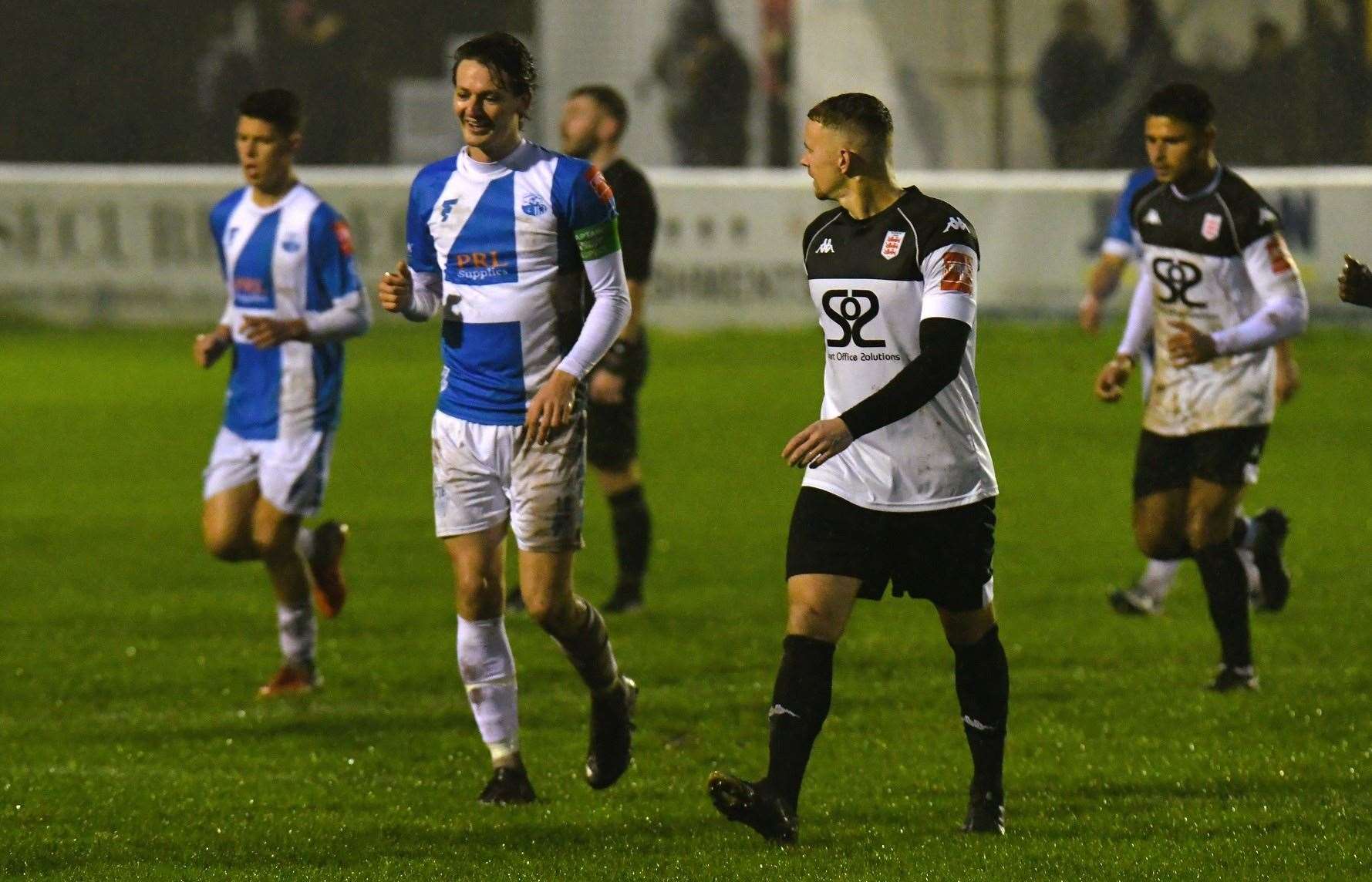 Sheppey skipper Billy Bennett and Faversham's Matt Parsons share a joke. Picture: Marc Richards