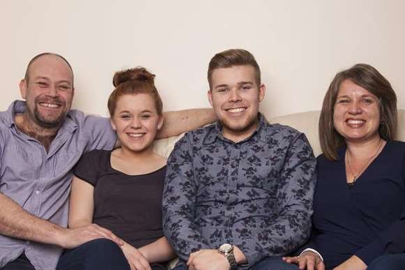 Jamie surrounded by his family, including mum Sharla, right