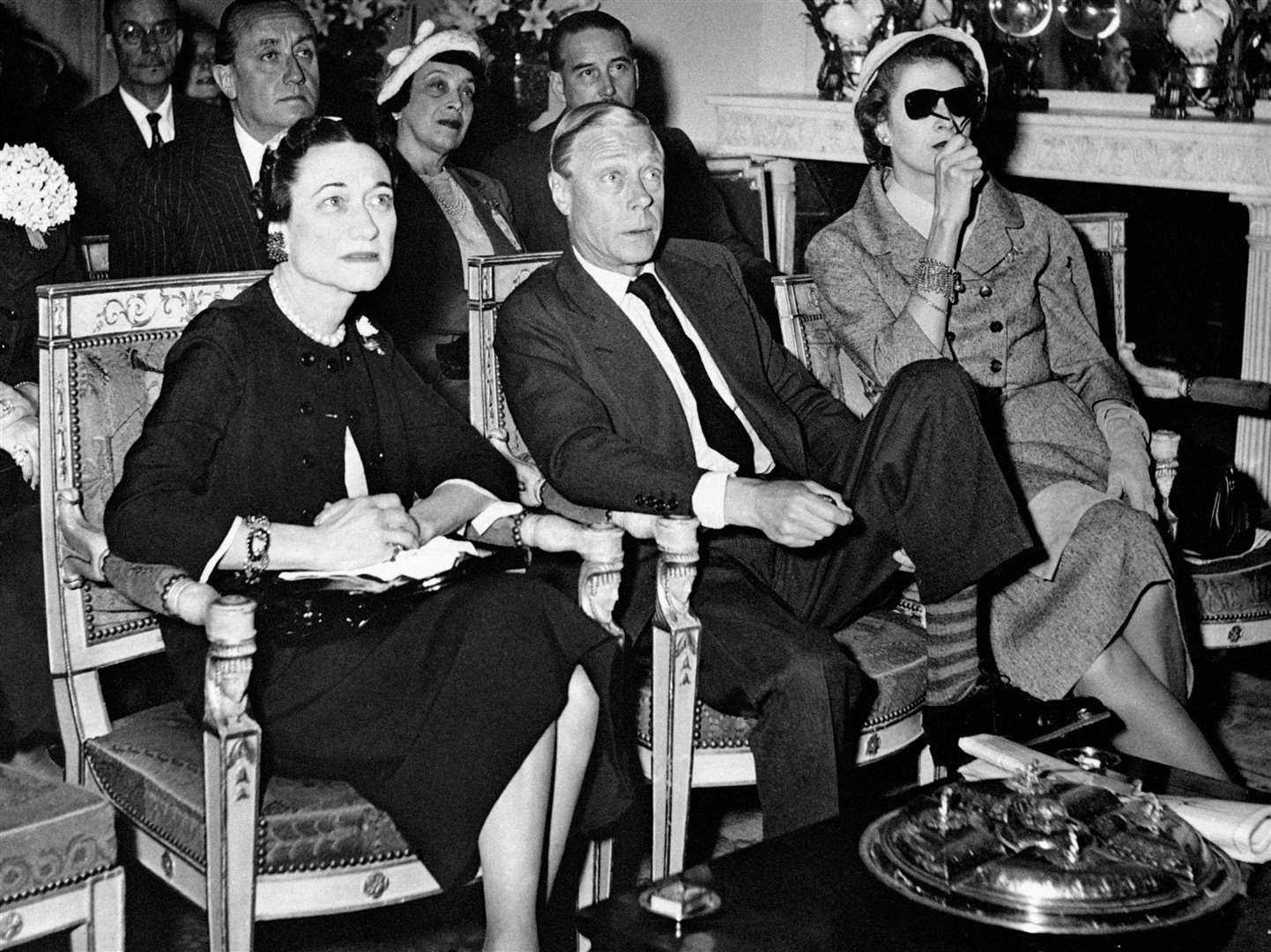 The Duke and Duchess of Windsor watch the coronation of Queen Elizabeth II at the Paris home of American millionaire Margaret Biddle (right) (PA)