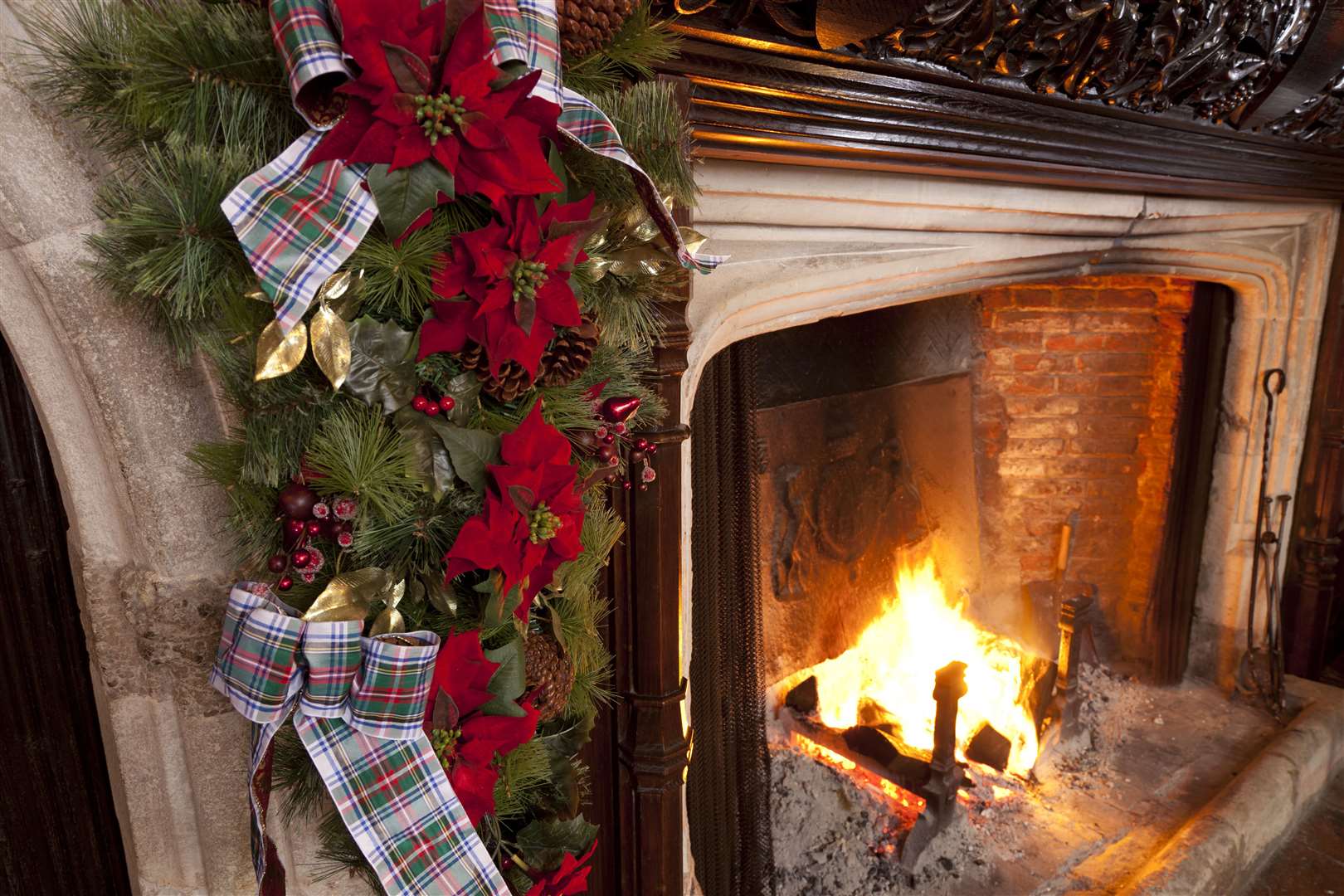 Cosy up in front of the fire at Ightham Mote. Picture: © National Trust Images / John Miller