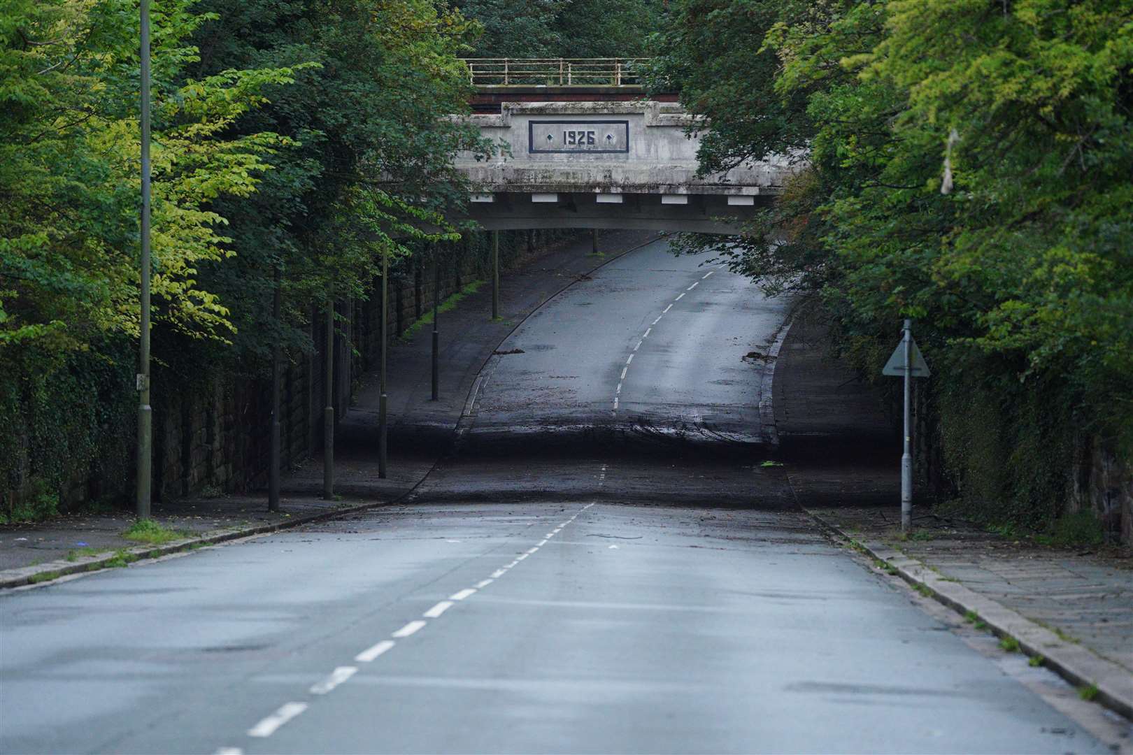 A view of Queens Drive in the Mossley Hill area of Liverpool where two people died after driving a car into a flood (Peter Byrne/PA)