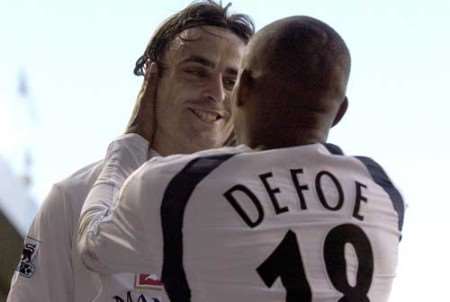 Dimitar Berbatov celebrates the opening goal with Jermain Defoe. Picture: MATT WALKER