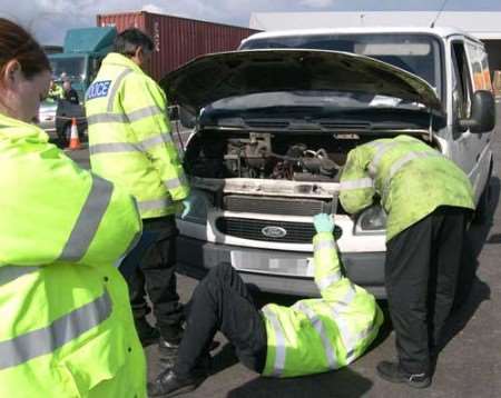 Police examine a car at Thamesport.