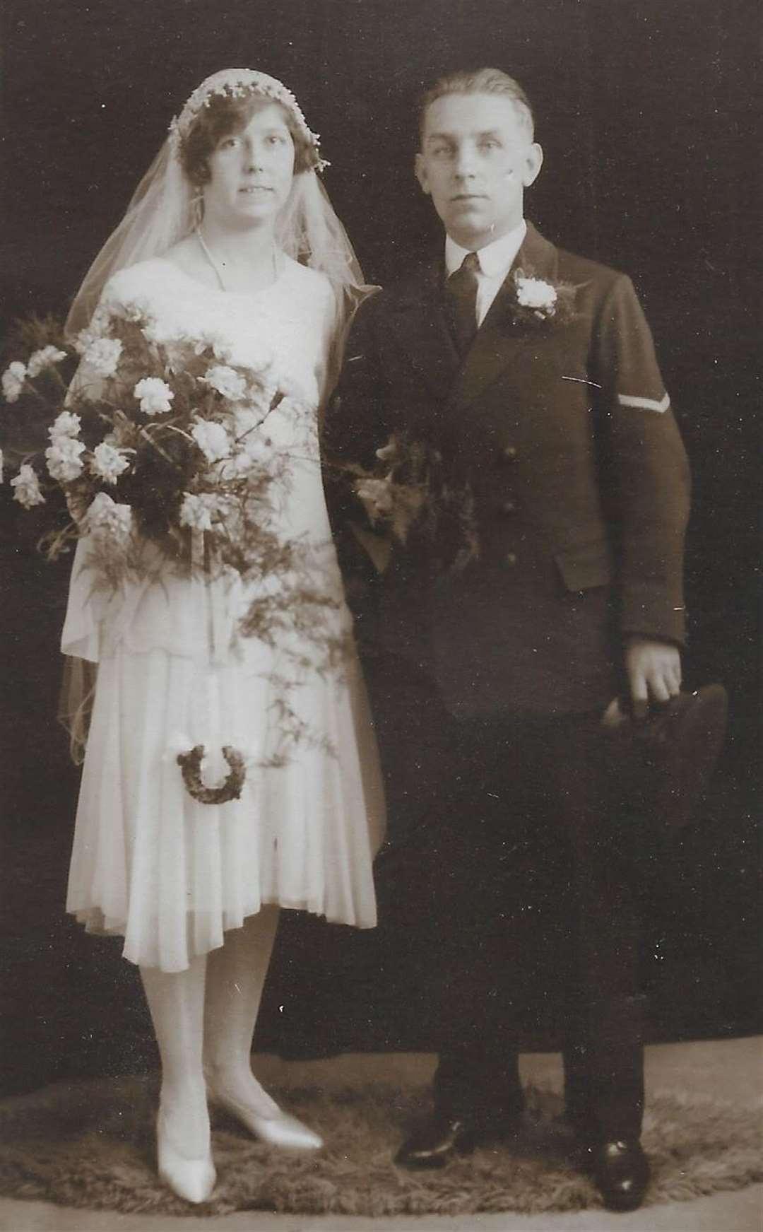 Wallace and Ivy on their wedding day at St Paul's Church, Chatham. Picture: Maggs Denness (18091909)