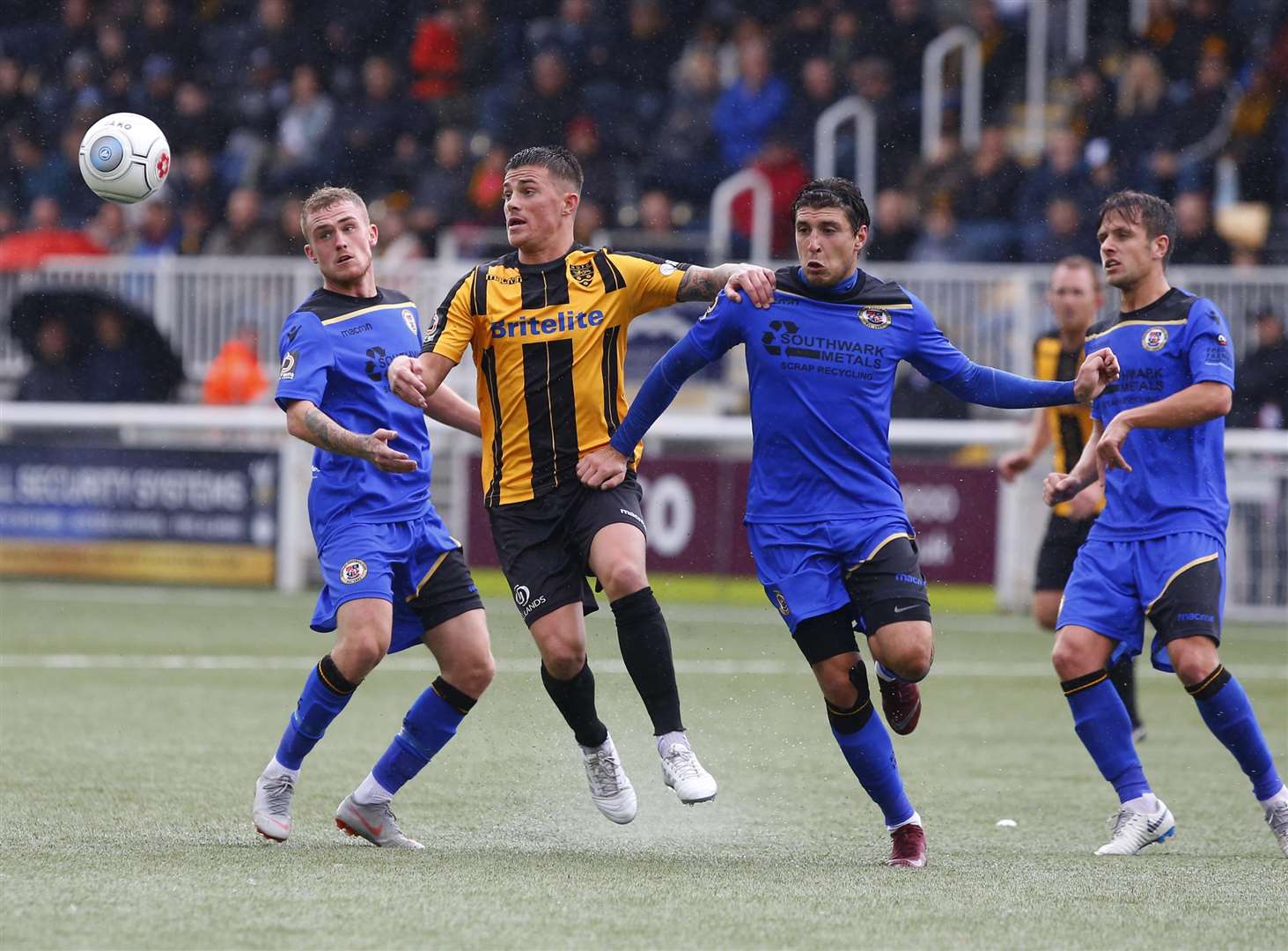Maidstone midfielder Jack Paxman has three Bromley players for company Picture: Andy Jones