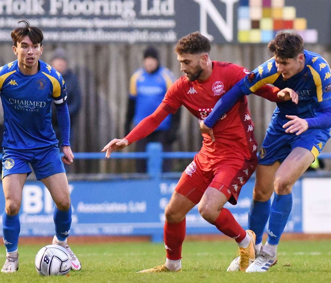 Dover striker Ben Williamson battles King's Lynn man Brett McGavin during Whites' 2-1 defeat on Saturday. Picture: Tim Smith