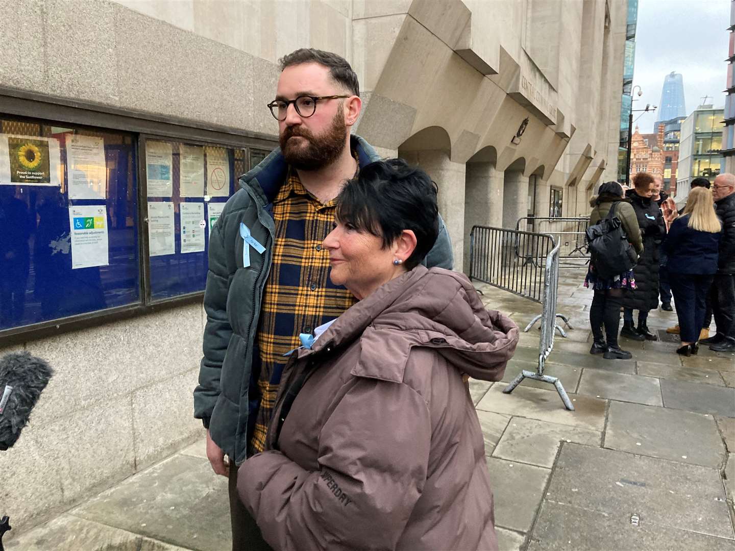 Harry Shotter, the brother of Natalie Shotter, and their mother Dr Cas Shotter Weetman, speak to the media outside the Old Bailey (Emily Pennink/PA)