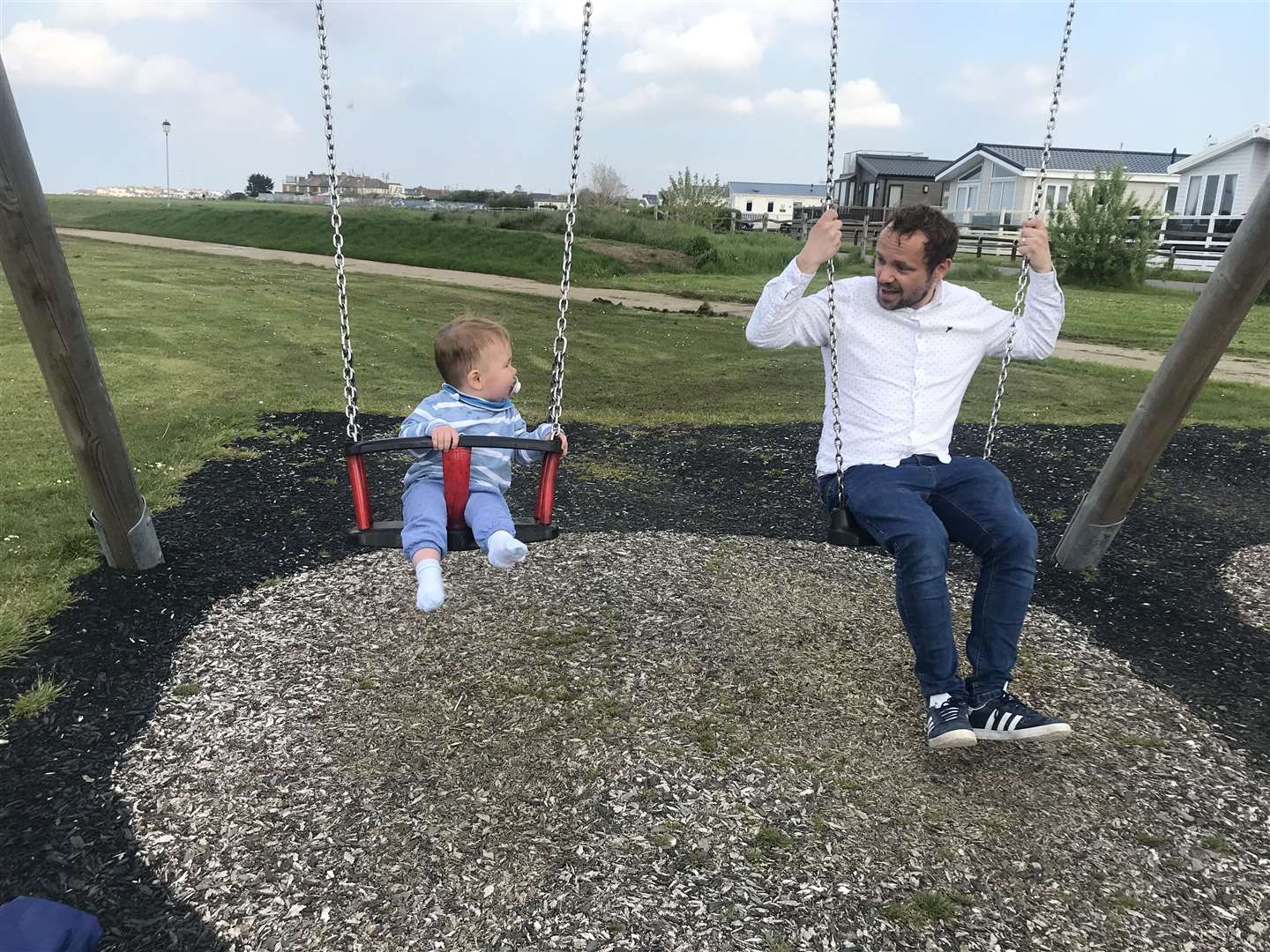 Enjoying some family time on the swings