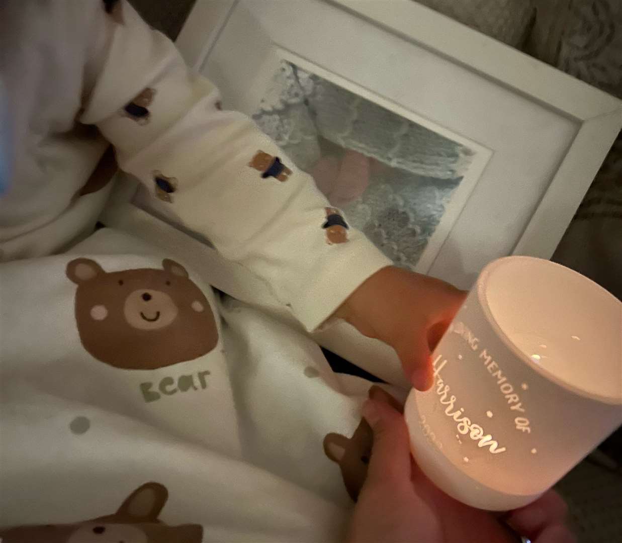 Fletcher holding candles to remember his twin, Harrison. Picture: Emily Cooke