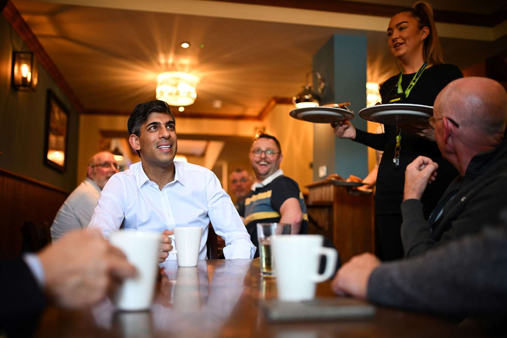 Rishi Sunak meeting veterans at a community breakfast in his constituency in Northallerton, North Yorkshire (Oli Scarff/PA)