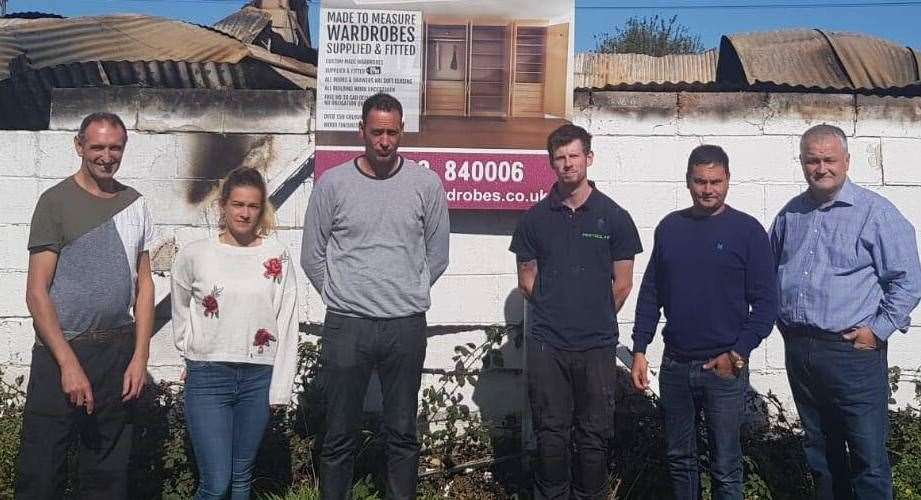 Craig Judge, second from right, his wife, Emma and their four staff