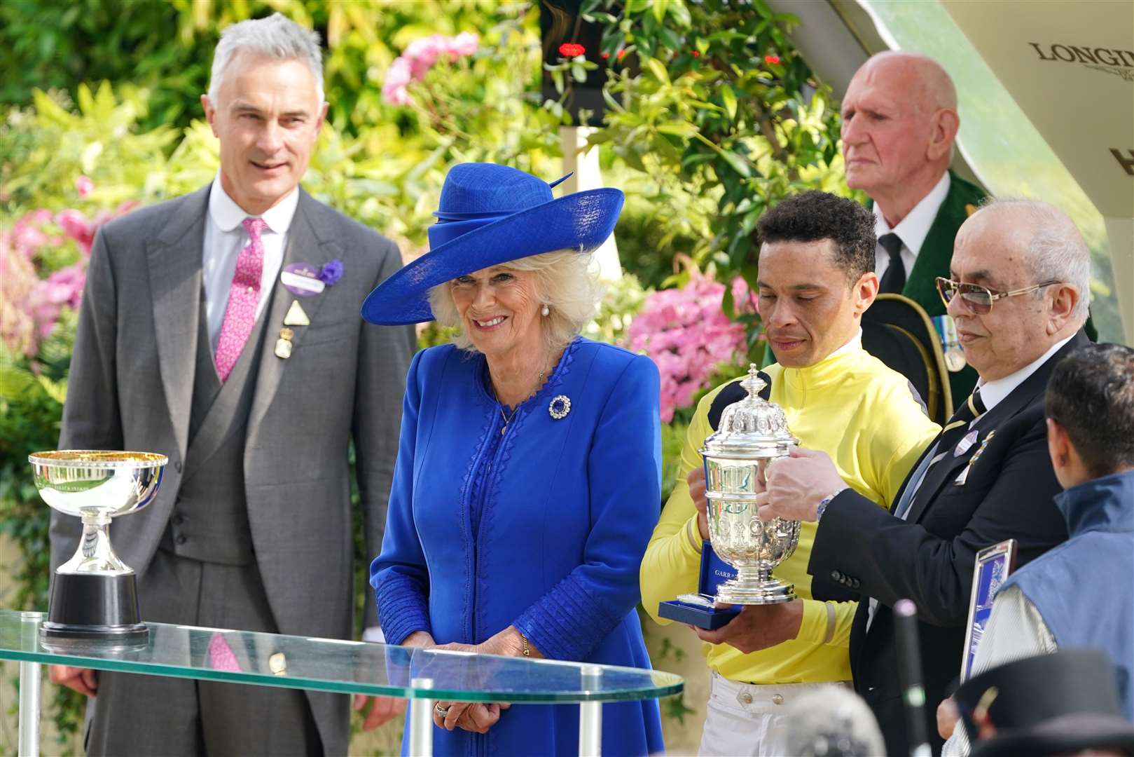 The Queen presents a trophy to winning jockey Sean Levey following the St James’s Palace Stakes on day one of Royal Ascot (Jonathan Brady/PA)