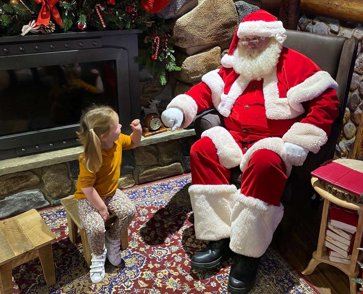 Giving Santa a fist-bump in Hamleys