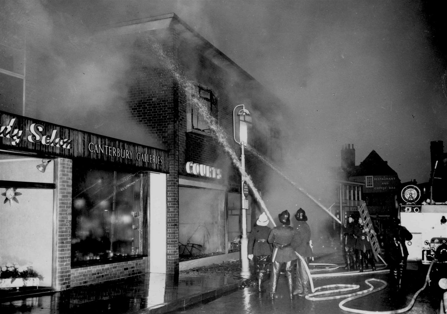 The blaze at Courts furniture showrooms and store in Burgate, Canterbury in May 1964. The store was built only five years before to replace another severely damaged by fire.