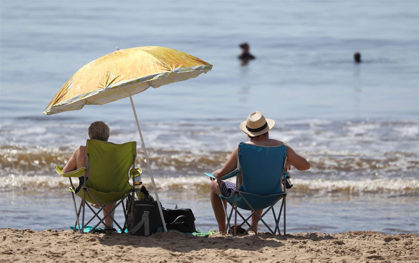 People enjoy the hot weather at Bournemouth beach in Dorset (Andrew Matthews/PA)