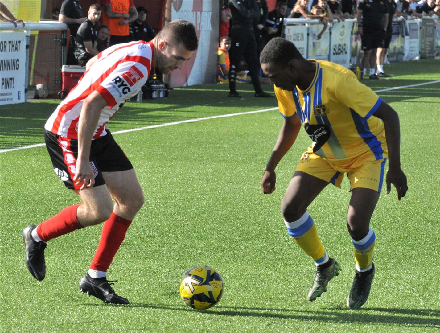 Sheppey United's Danny Leonard, left, takes on Sittingbourne. Picture: Paul Owen Richards