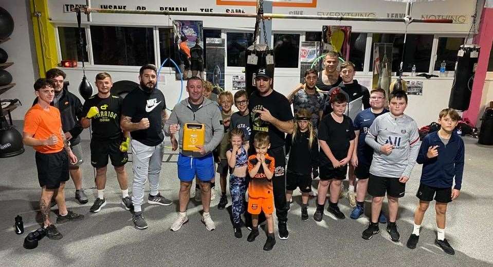 Invicta Boxing Academy are now affiliated with England Boxing, the sport's governing body. Former professional Gavin Tait is pictured with the club's defibrillator - a requirement of the affiliation process