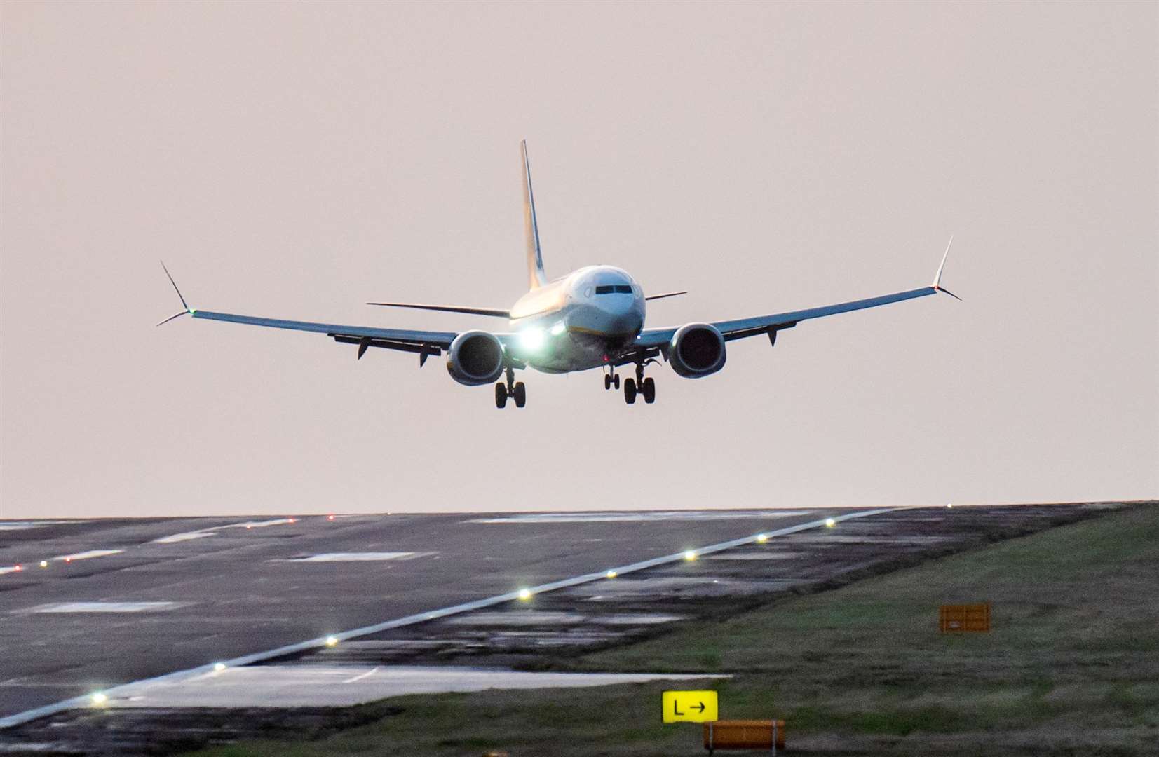 A Ryanair jet comes in to land at Leeds Bradford Airport during high winds caused by the latest storm to hit the country (Danny Lawson/PA)