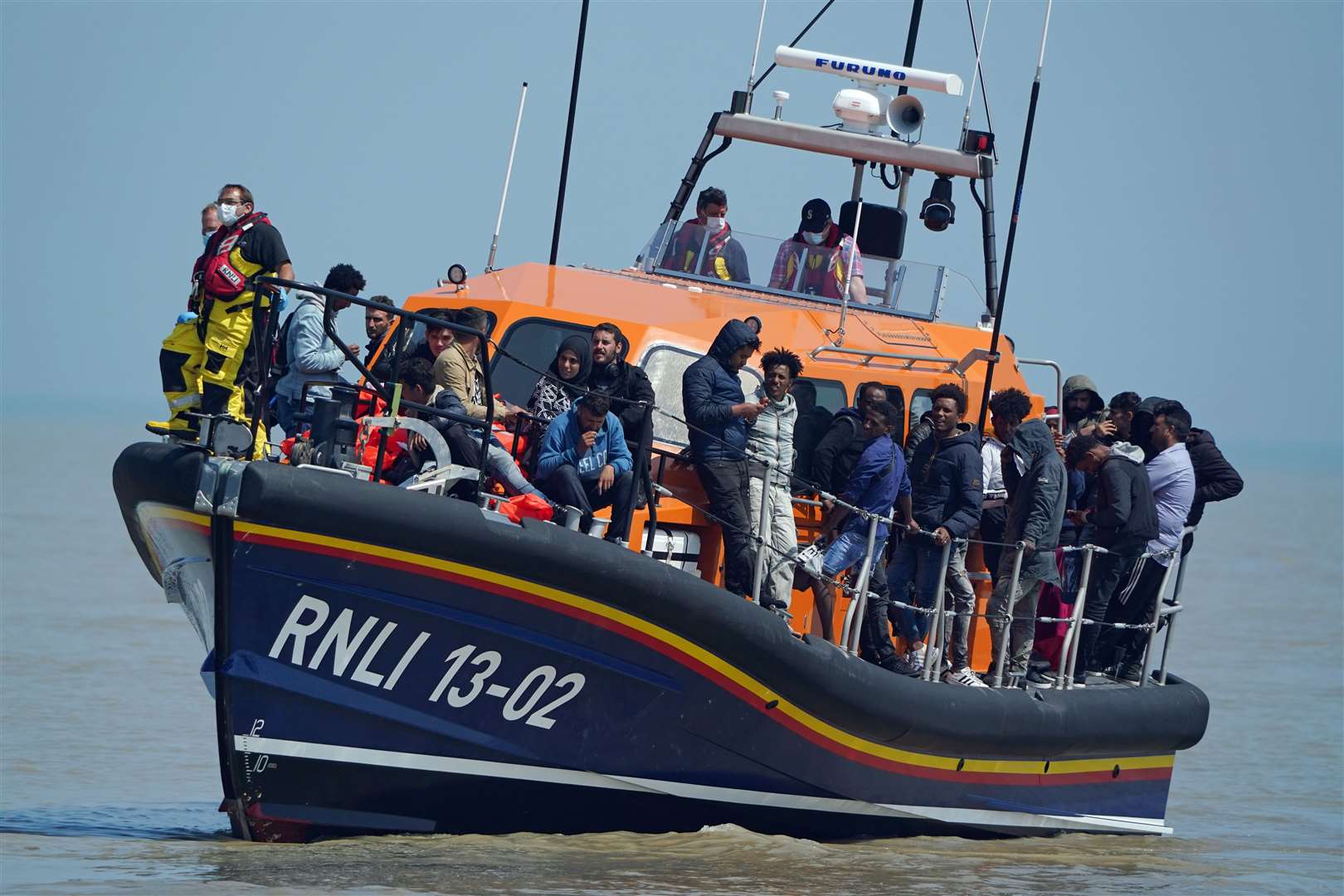 A group of people thought to be migrants crossing from France (Gareth Fuller/PA)