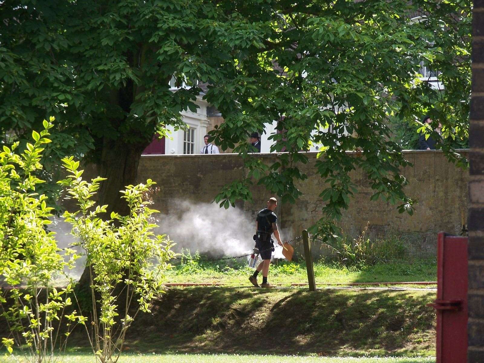 Using a smoke machine to set the scene for filming in the Historic Dockyard, Chatham Pic: Adrian Griffiths