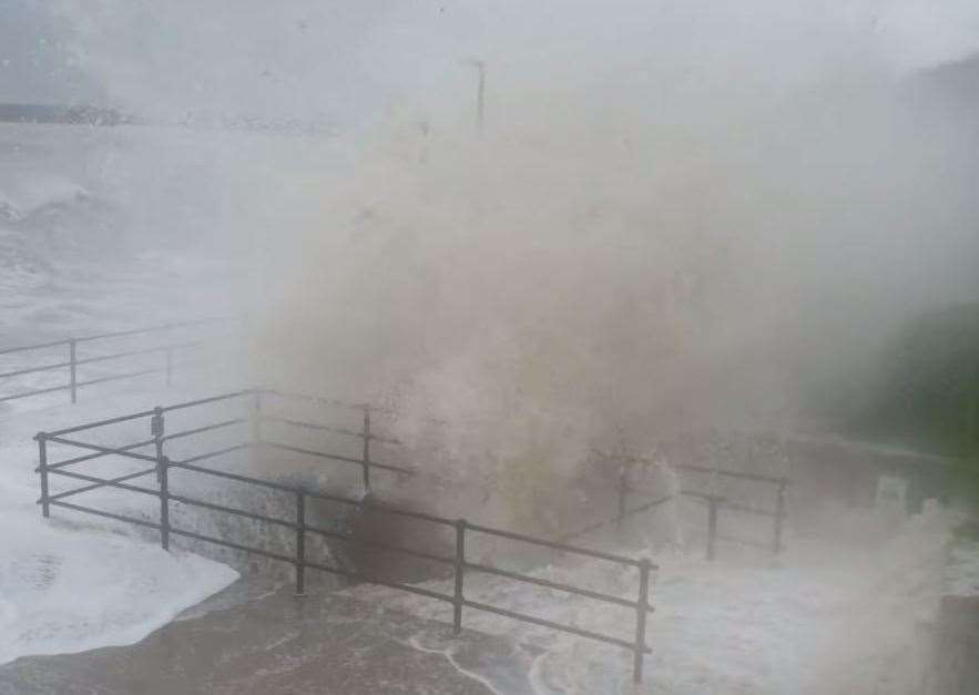 The boys are out of sight as they are engulfed by the giant wave