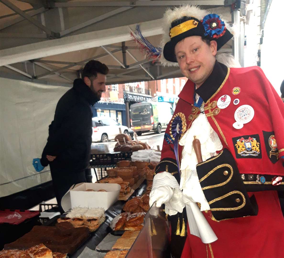 Town crier Chris Conlan seen here at the bread and cakes stall. Picture: Sevenoaks Town Council