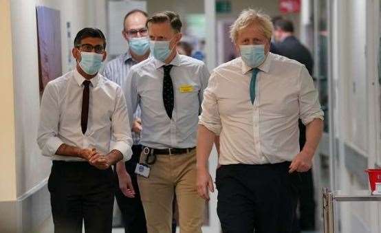 Prime Minister Boris Johnson and Chancellor Rishi Sunak with Miles Scott, chief executive of the Maidstone and Tunbridge Wells NHSAS Trust Picture: Gareth Fuller/PA