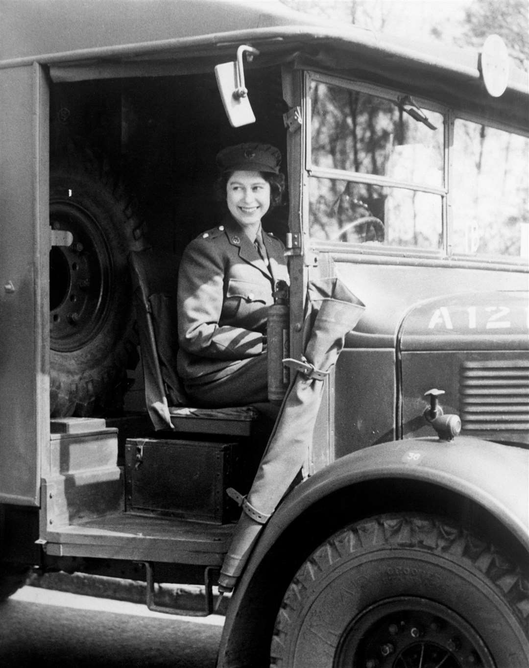 Princess Elizabeth at the wheel of an Army vehicle when she served during the Second World War in the Auxiliary Territorial Service in 1945 (PA)