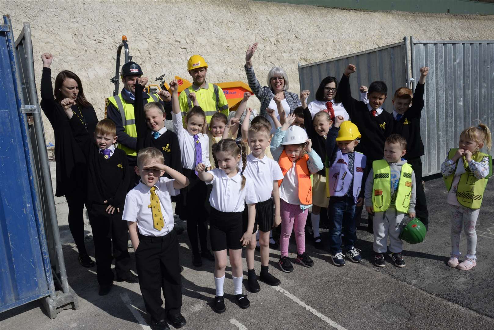 Pupils, staff and contractors on a tour of inspection of work on the extensions to White Cliffs Primary School