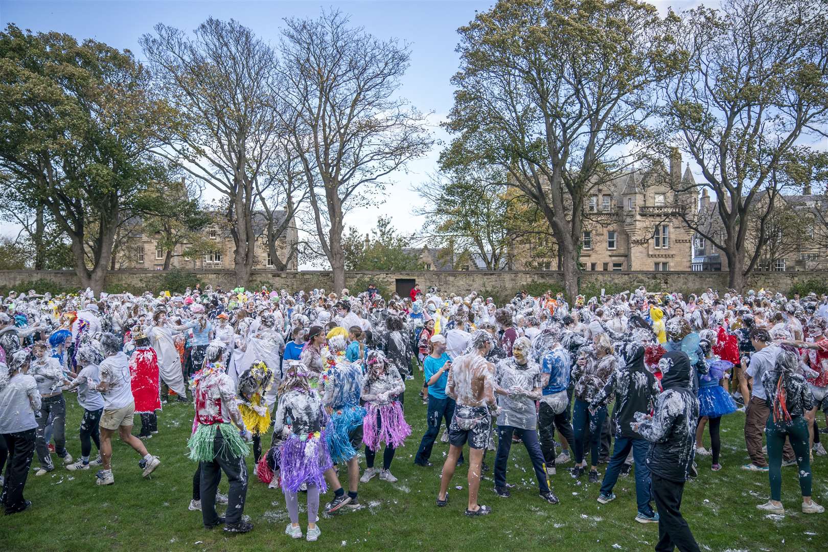 Students in fancy dress on university lawn (Jane Barlow/PA)