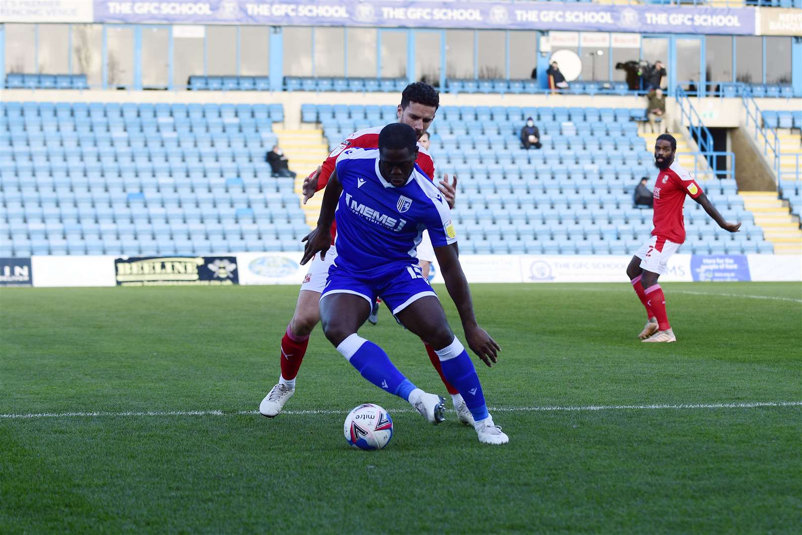 John Akinde holds off a Swindon defender Picture: Barry Goodwin