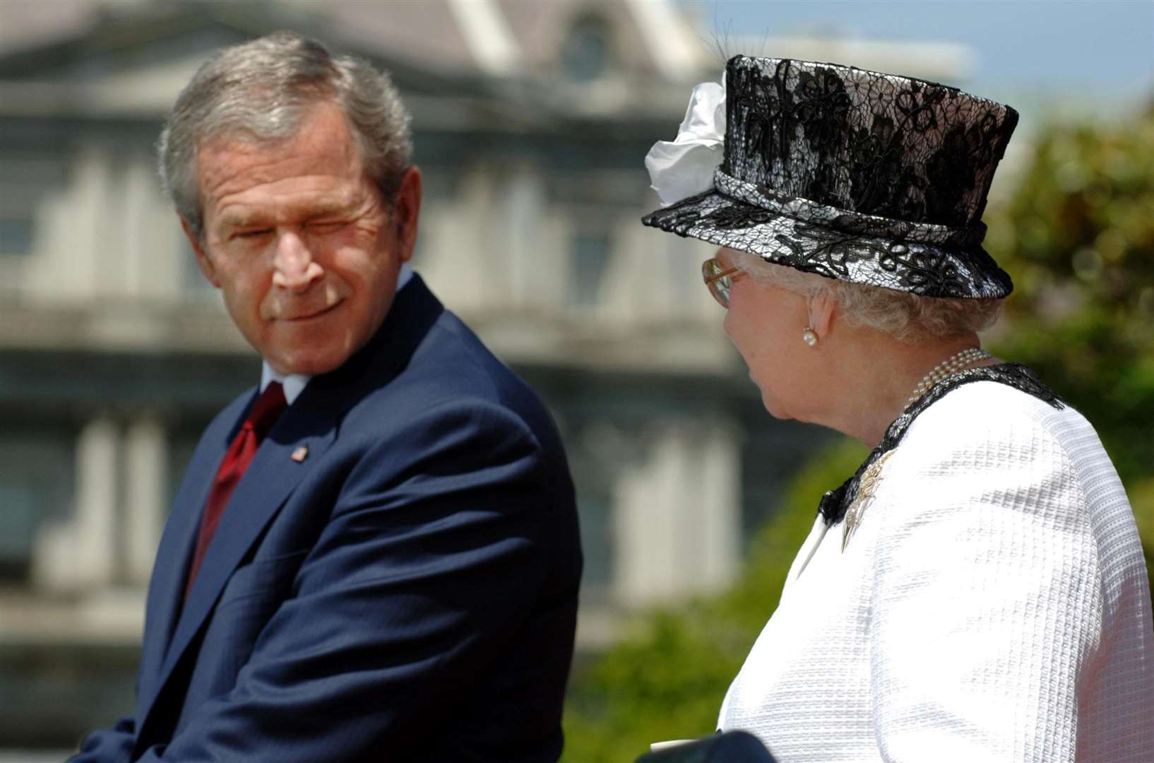 George Bush winks at the Queen (Fiona Hanson/PA)