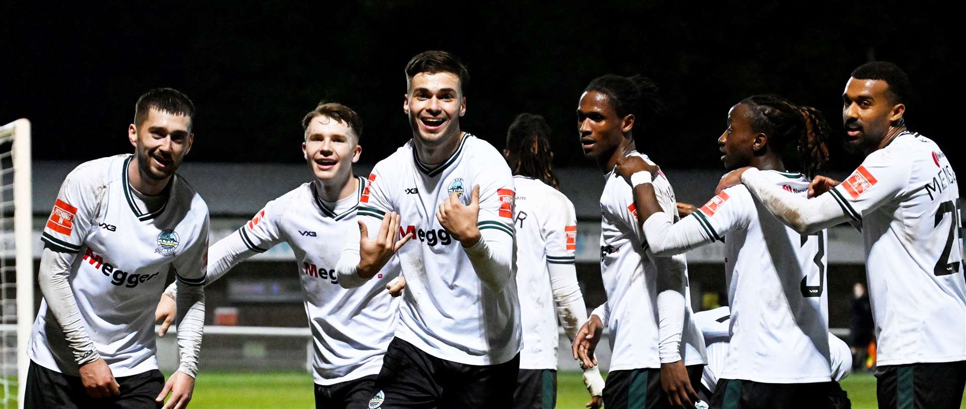 Dover’s players celebrate their all-important third goal. Picture: Barry Goodwin