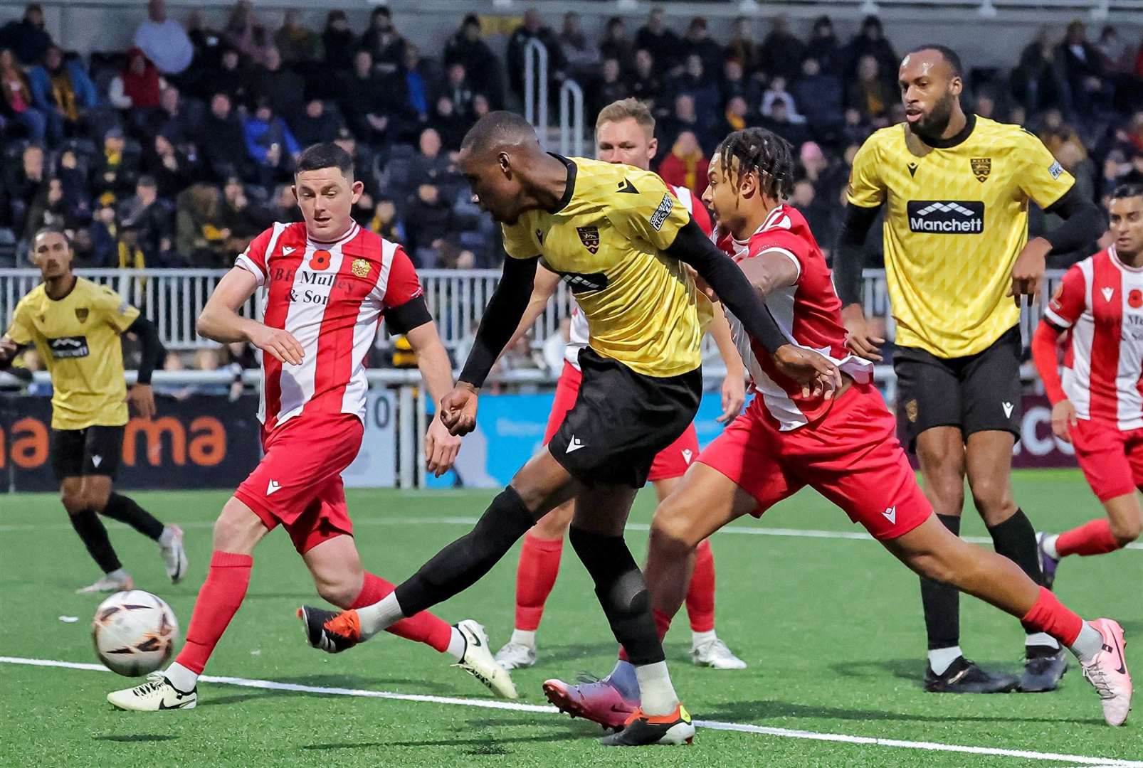 Temi Eweka tries his luck in a busy penalty box during the second half. Picture: Helen Cooper