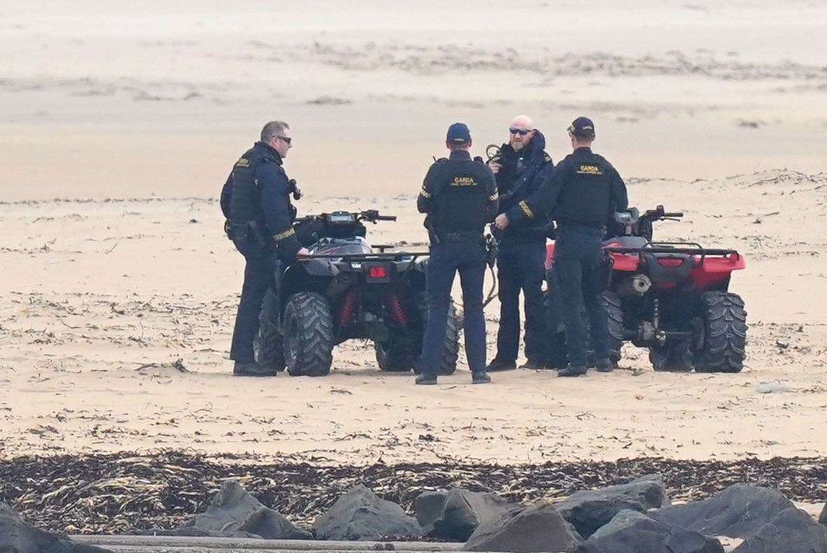 Armed Garda officers on a beach near Trump International Golf Links & Hotel in Doonbeg, Co Clare (PA/Niall Carson)