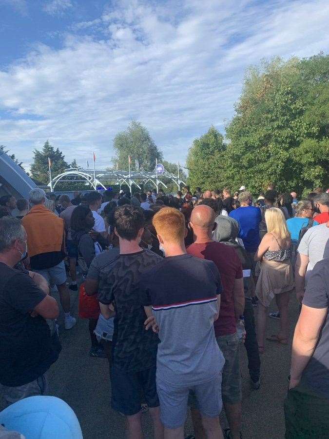 A crowd of people at Thorpe Park in Surrey after reports a police incident at the park (@abbiesear29)