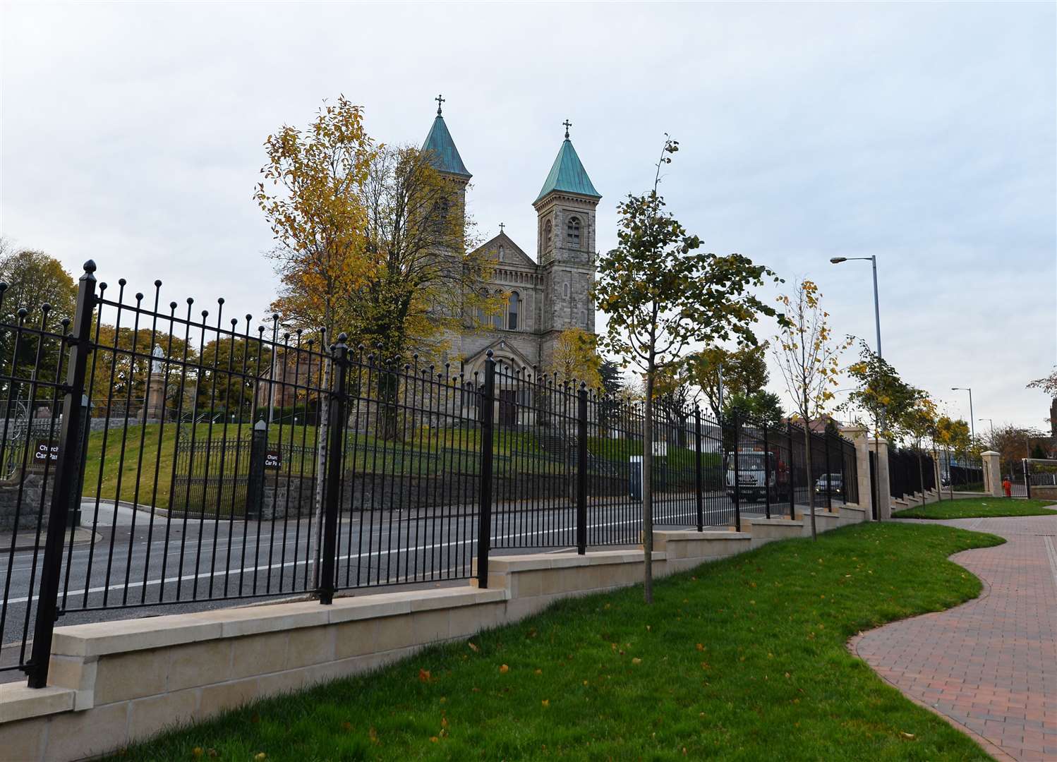 An area where a peace wall once stood at the top of the Crumlin Road in Belfast opposite Holy Cross Church (NI Housing Executive/PA)