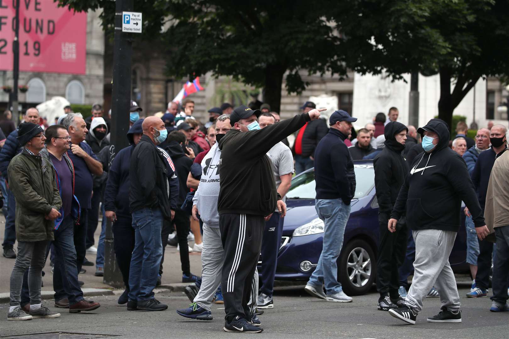 Loyalist Defence League members in George Square (Jane Barlow/PA)