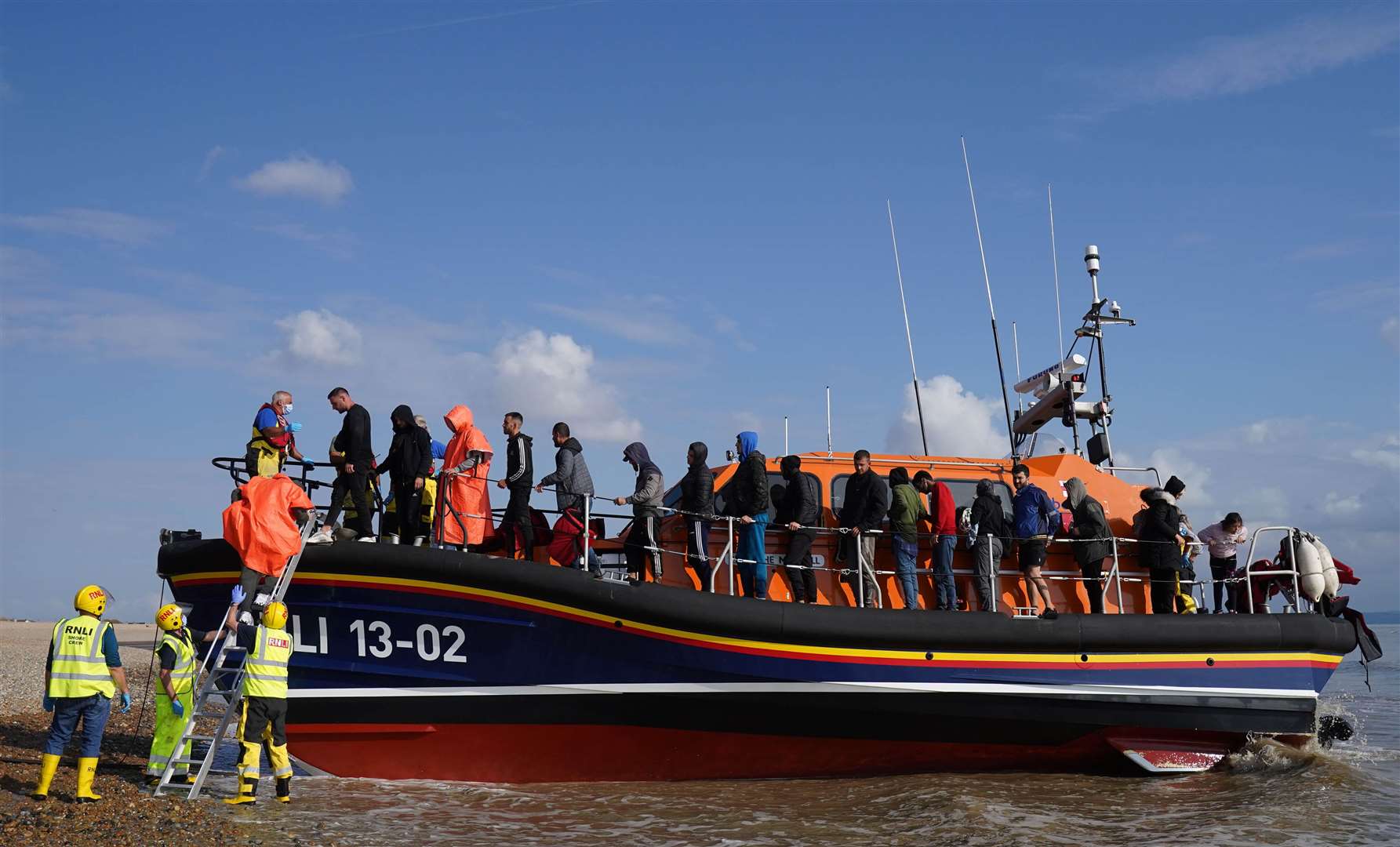 A group of people thought to be migrants are brought in to Dungeness (Gareth Fuller/PA)