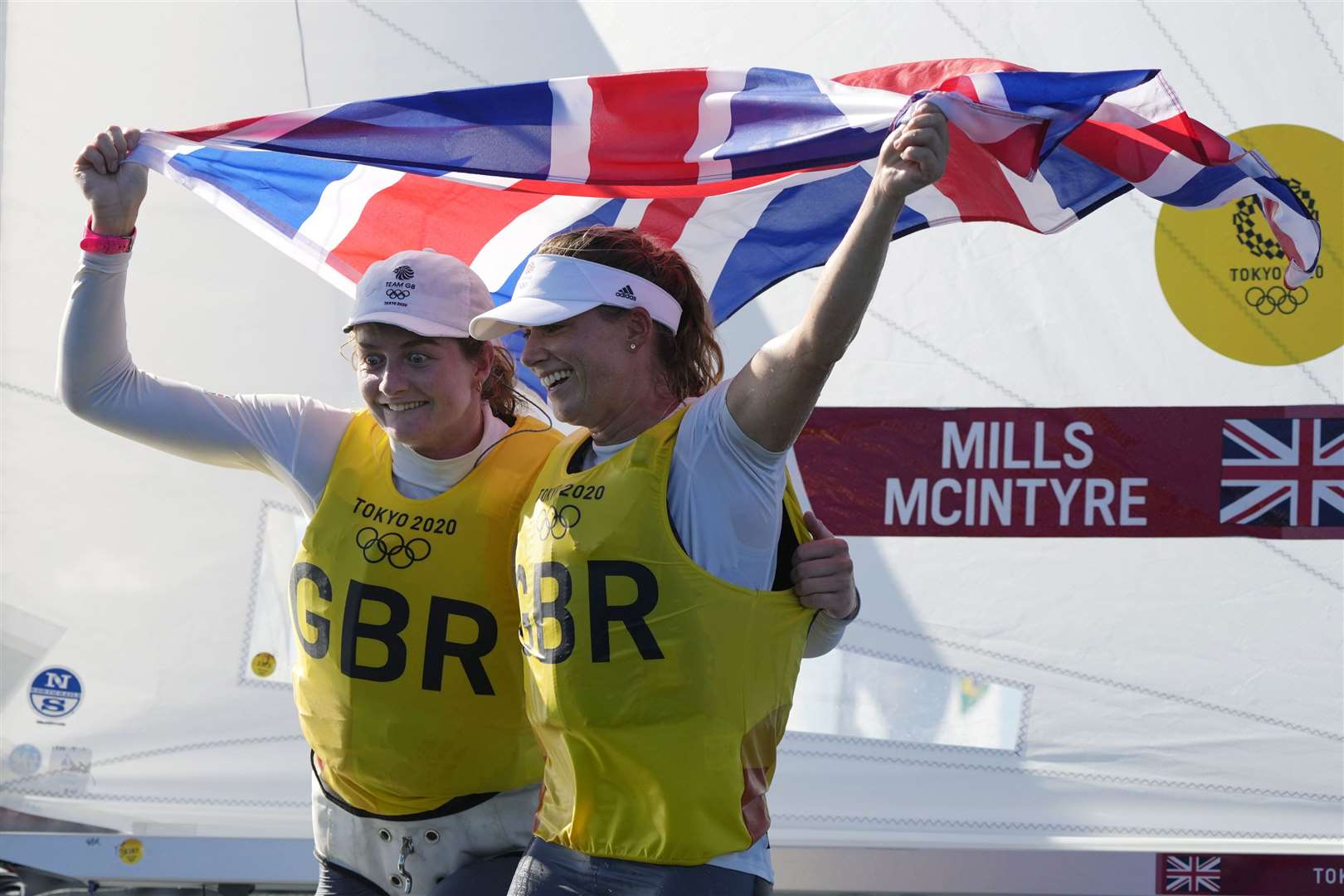 Hannah Mills and Eilidh McIntyre celebrate after winning the women’s 470 race (Gregorio Borgia/AP)