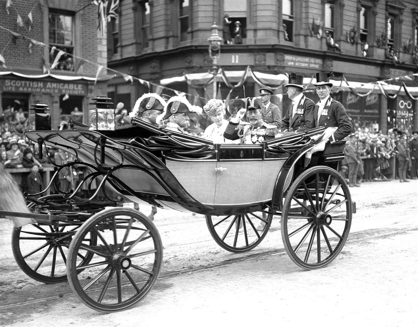 King George V and Queen Mary passing through the streets of Belfast when they opened the Ulster Parliament (PA)