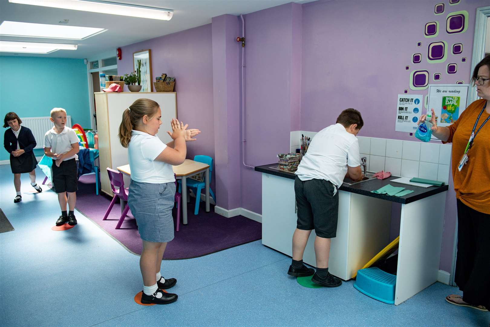 Children abide by a traffic light system for social distancing when washing their hands at Kempsey Primary School in Worcester (Jacob King/PA)