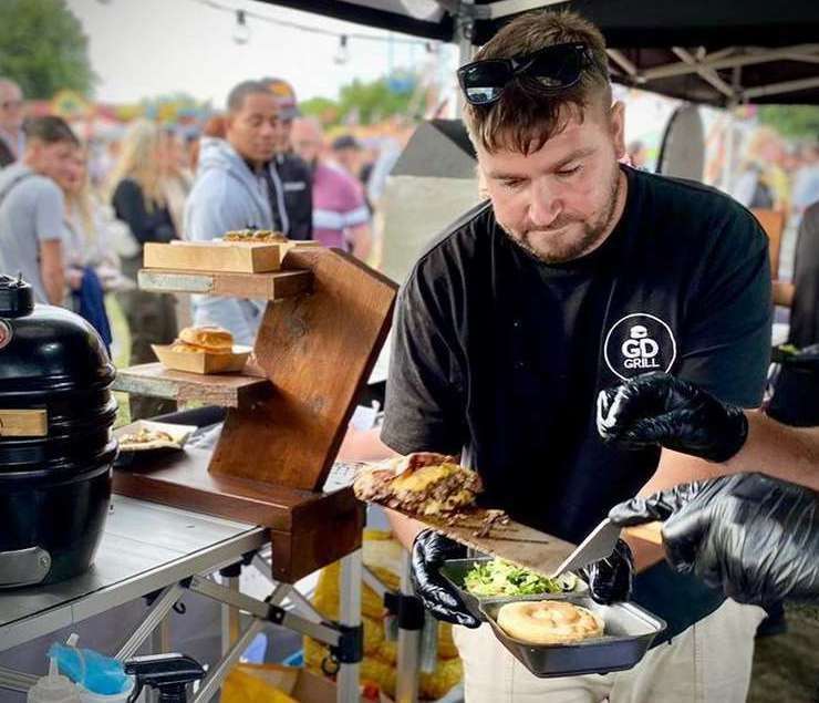 Mr Sproston making one of his many burgers. Picture: The Grumpy Dads Grill