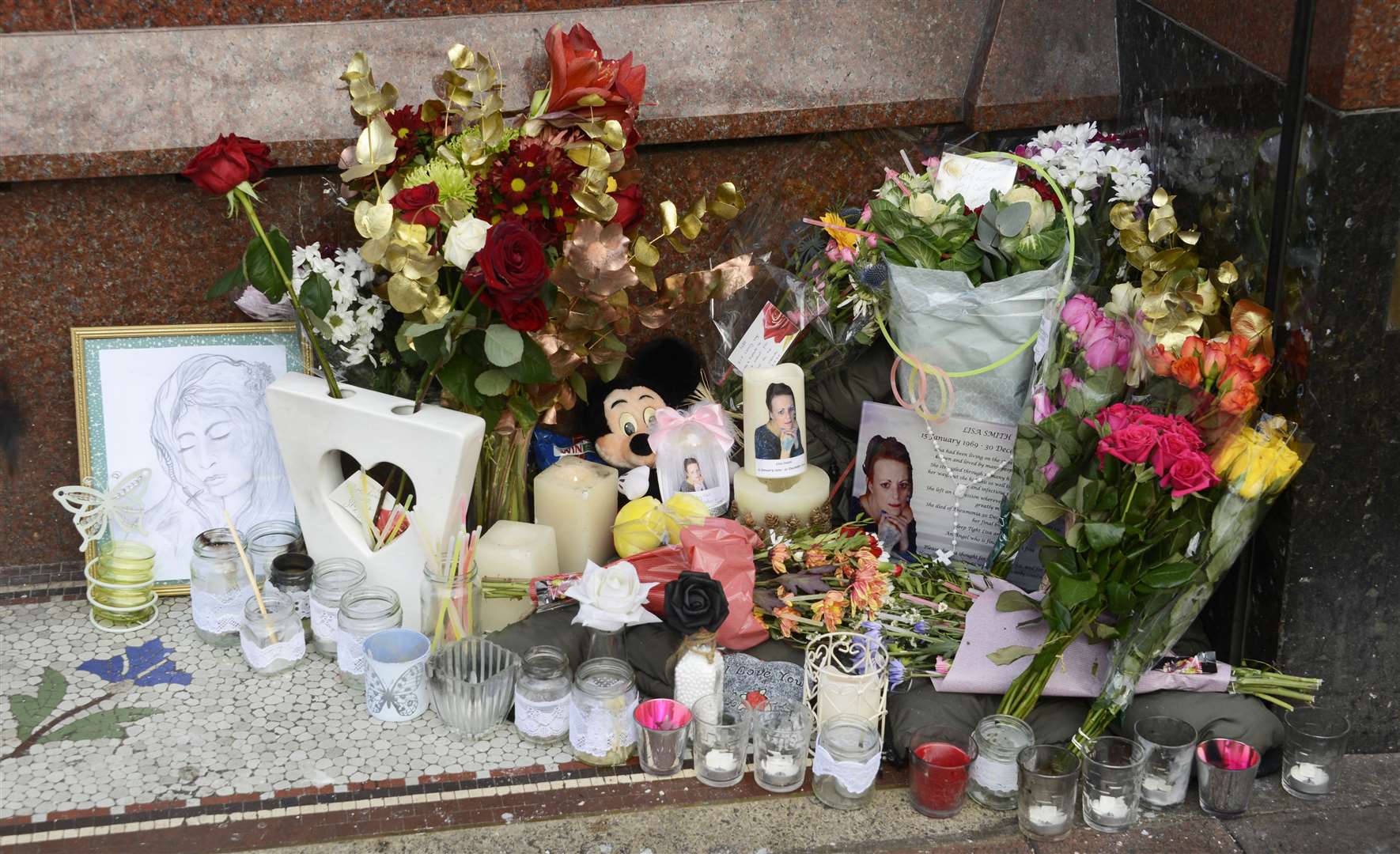 Cards and flowers were laid in Lower High Street, Ashford, in memory of Lisa Smith Picture: Paul Amos