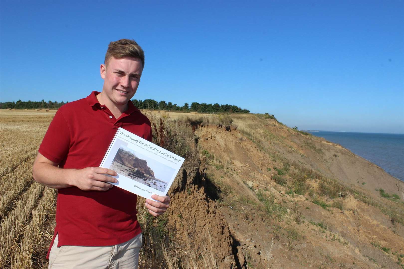 James Attwood of SW Attwood and Partners on the cliffs with a brochure for an ambitious £500 million scheme to rebuild Sheppey's crumbling coastline with a new sea wall and country park